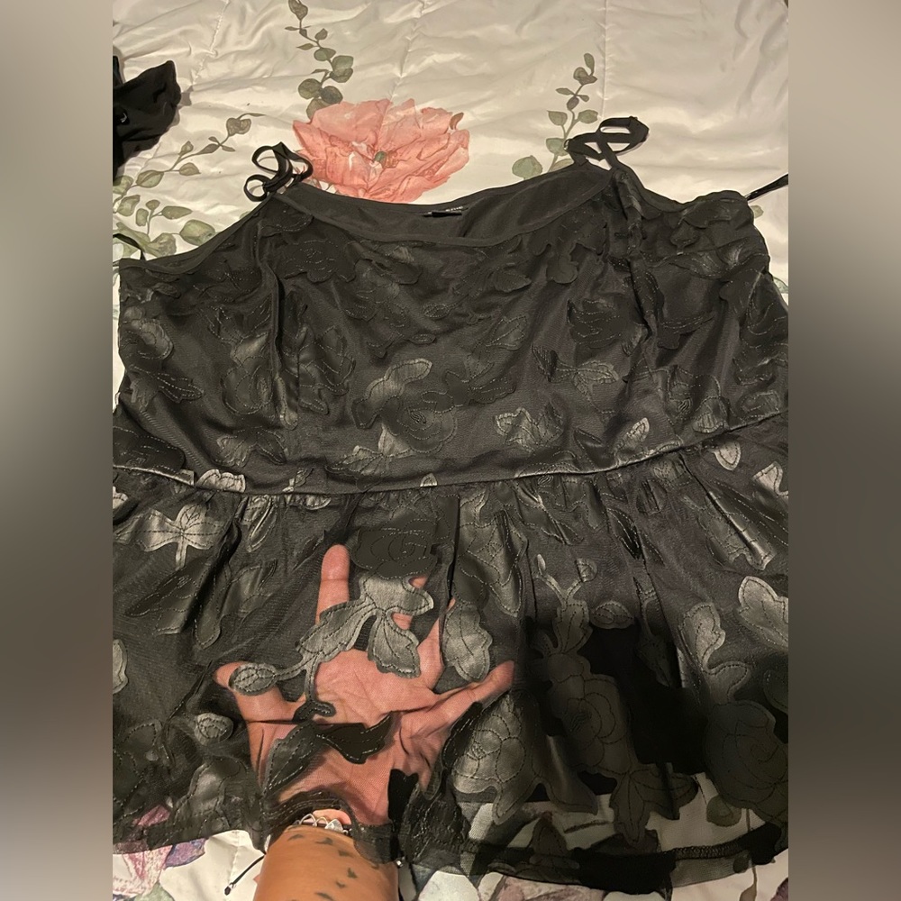 Torrid size 3 black sheer top with lining. Cami peplum style.
